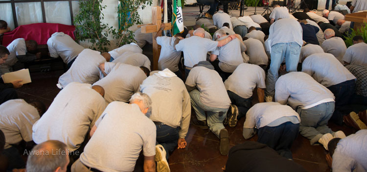 Malachi Dads—inmates of Angola prison—on their knees before God 