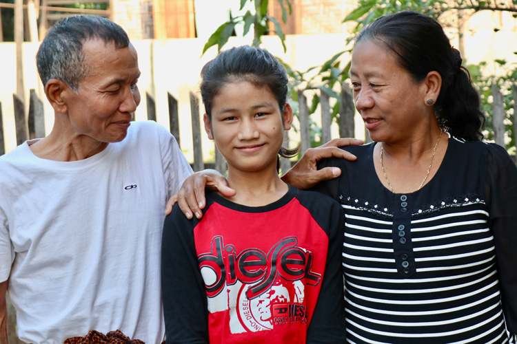 Picture of former orphan reconciled with family