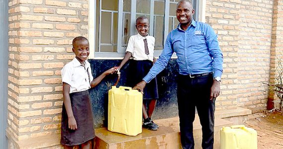 Image of father in Rwanda with safe water