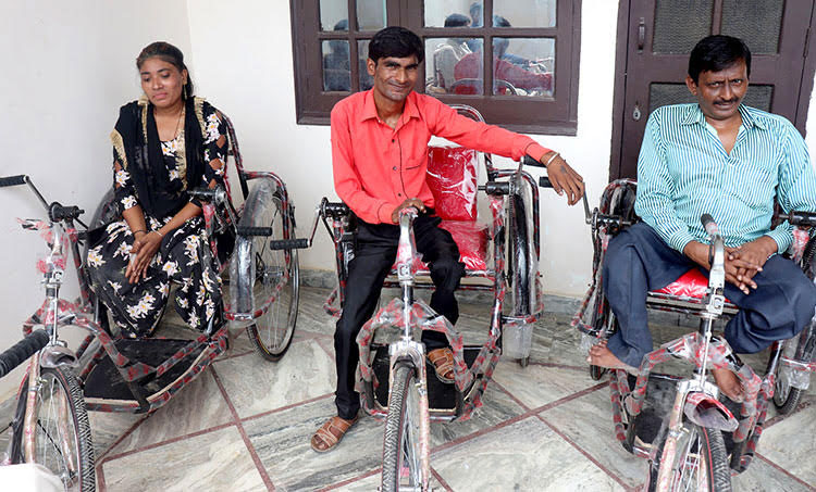 Picture of disabled man in India with tricycle