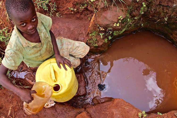 Picture of boy gathering water