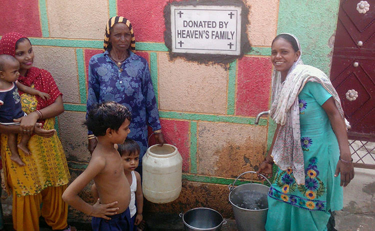 villagers in india drinking pure water