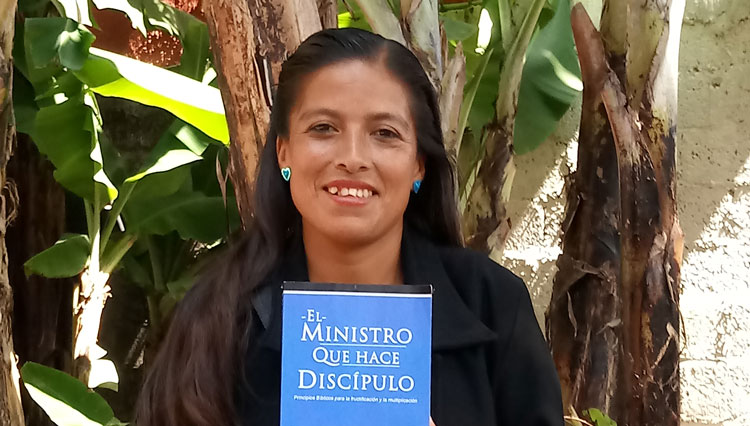 Paz Islas Rufino from Mexico with Disciple-Making Minister book