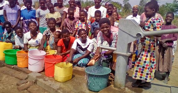 Picture of villagers in Malawi with clean water
