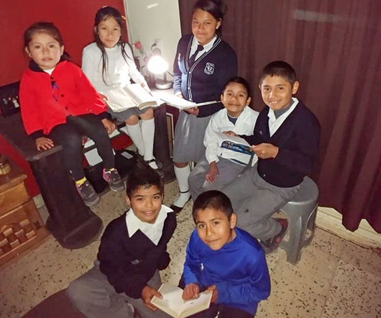 Picture of children in Mexico with electricity working