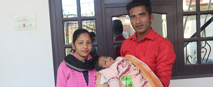 Picture of family in India with miracle baby