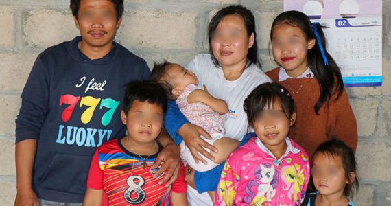 Picture of microloan ministry borrower with family in communist nation
