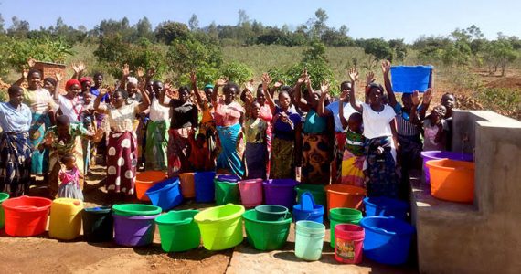 Villagers in Malawi enjoying clean water