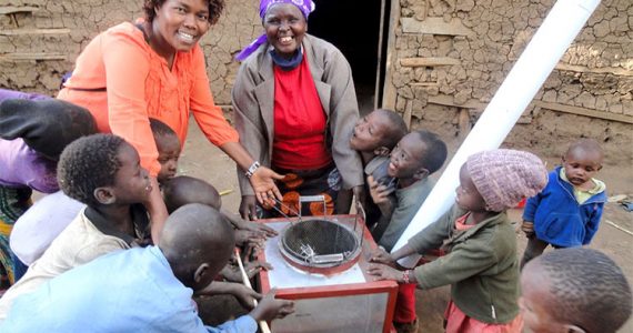 Picture of Kenyan widow receiving her new stove