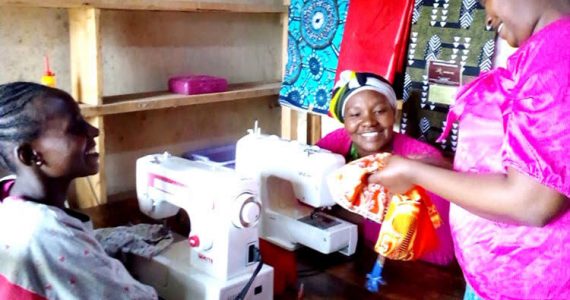 Picture of widows and abandoned women in Kenya learning to sew