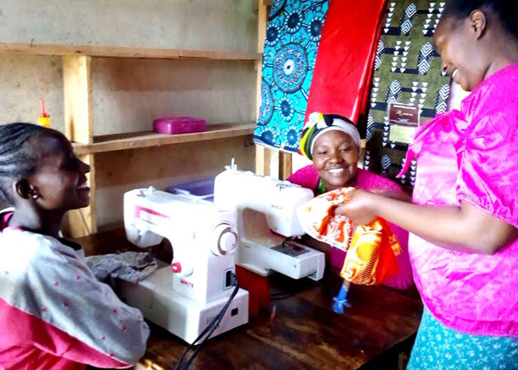 Picture of widows and abandoned women in Kenya learning to sew