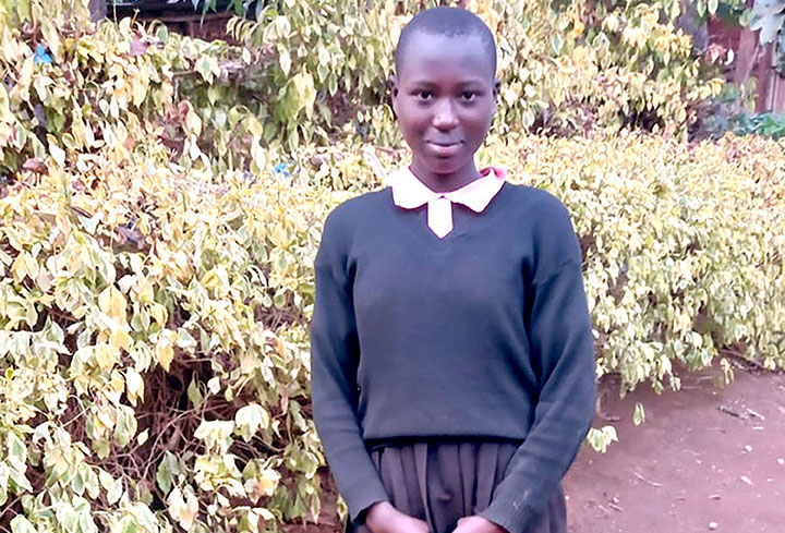 Image of student in Kenya with uniform