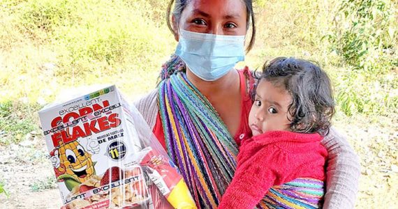 Image of mom and child in Guatemala receiving food aid