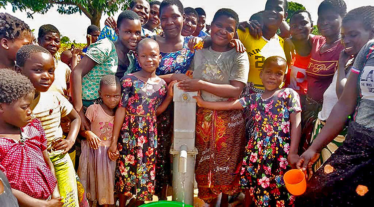 Image of villagers in Malawi with safe water