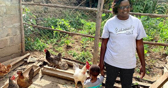 Image of borrower in Kenya with chickens