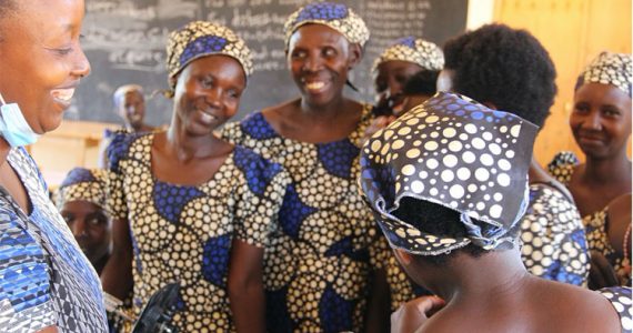 Image of women in Rwanda learning how to sew