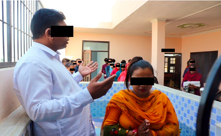 Image of secret rooftop baptism in India